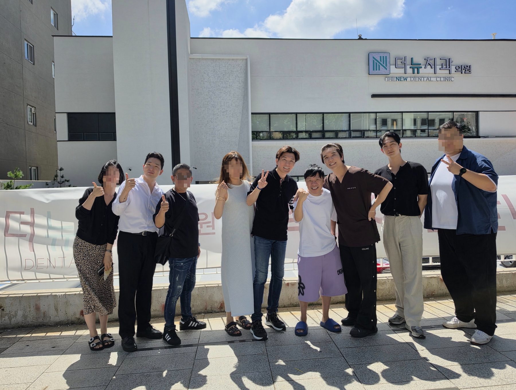 Japanese patients with THE NEW MEDILINK and BonBon Medical staff in front of THE NEW Dental Clinic